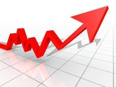 Business Graph with arrow showing profits and gains on a white reflective background